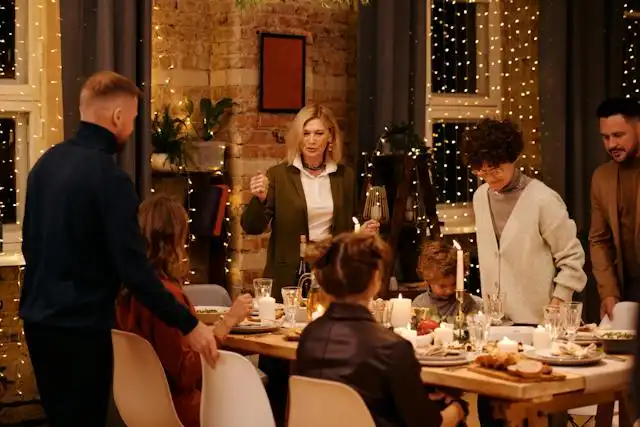 A group of people at a dinner table on Christmas Eve